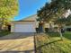 Charming single-Gathering home boasts a well-maintained lawn and a two-car garage at 15090 Waterford Chase Pkwy, Orlando, FL 32828