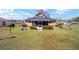 View of the home's backyard and exterior of the home at 154 Pecan Dr, Ocala, FL 34472