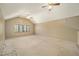Large bedroom with vaulted ceiling, two fans, and a window at 154 Pecan Dr, Ocala, FL 34472