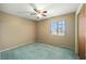 Cozy bedroom featuring a ceiling fan, window, and neutral walls at 154 Pecan Dr, Ocala, FL 34472