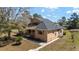 Two-story home with a cozy front porch, featuring a dark roof and natural exterior at 154 Pecan Dr, Ocala, FL 34472