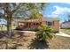 Charming single-Gathering home featuring a covered porch, mature tree, and well-maintained landscaping in a quiet neighborhood at 154 Pecan Dr, Ocala, FL 34472