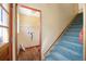 Laundry area with storage, next to carpeted stairs at 154 Pecan Dr, Ocala, FL 34472