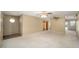 Spacious living room featuring carpet floors, neutral color paint, ceiling fans, and natural light from a large window at 154 Pecan Dr, Ocala, FL 34472
