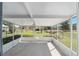 Outdoor patio with screened in walls and ceiling fan at 154 Pecan Dr, Ocala, FL 34472