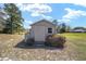 Exterior of the shed in the backyard, surrounded by vegetation at 154 Pecan Dr, Ocala, FL 34472