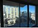 Enjoy city views from the balcony overlooking nearby high-rise buildings and a pool at 155 S Court Ave # 1506, Orlando, FL 32801
