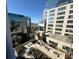 Enjoy city views and landscaping from the balcony overlooking nearby buildings and gardens at 155 S Court Ave # 1506, Orlando, FL 32801