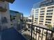 From the balcony enjoy spectacular city views, landscaping and the surrounding buildings at 155 S Court Ave # 1506, Orlando, FL 32801
