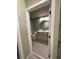 Modern bathroom featuring a vanity with a round mirror and tiled floors at 155 S Court Ave # 1506, Orlando, FL 32801