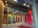 Inviting condo building entrance with large glass doors and prominent address display at 155 S Court Ave # 1506, Orlando, FL 32801