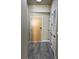 Hallway features gray floors, a front door, and closet at 155 S Court Ave # 1506, Orlando, FL 32801