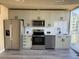 Modern kitchen with stainless steel appliances, ample cabinet space and a bright atmosphere at 155 S Court Ave # 1506, Orlando, FL 32801