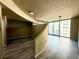 Bright living room featuring neutral walls and flooring, and floor to ceiling windows with a city view at 155 S Court Ave # 1506, Orlando, FL 32801