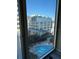 View of a city building and pool from a condo window at 155 S Court Ave # 1506, Orlando, FL 32801