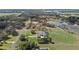 Large, green lawn surrounds this serene property, featuring an in-ground pool at 15523 Trotting Horse Ln, Tavares, FL 32778