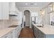 Modern kitchen with stainless steel appliances and stone countertops at 15523 Trotting Horse Ln, Tavares, FL 32778