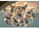 Eye-catching silver light fixture that creates a unique and modern design at 15523 Trotting Horse Ln, Tavares, FL 32778