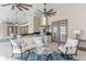 Outdoor kitchen with granite counters, stainless steel grill, and adjacent living space, perfect for entertaining at 15523 Trotting Horse Ln, Tavares, FL 32778