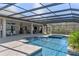 Beautiful pool and patio area with an outdoor bar and lounge at 15523 Trotting Horse Ln, Tavares, FL 32778