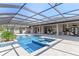 Gorgeous pool and patio with clear sky view and an outdoor bar at 15523 Trotting Horse Ln, Tavares, FL 32778