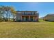 Expansive backyard with a covered patio, providing an inviting space for outdoor relaxation and entertainment at 1905 Snapper Dr, Kissimmee, FL 34759