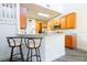 Kitchen featuring wood cabinets, stainless steel appliances, and granite countertops at 1905 Snapper Dr, Kissimmee, FL 34759