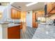 Kitchen featuring wood cabinets, stainless steel appliances, and granite countertops at 1905 Snapper Dr, Kissimmee, FL 34759