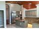 Modern kitchen featuring stainless steel appliances, a center island, and ample cabinet space at 202 Shady Oaks Cir, Lake Mary, FL 32746