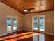 Cozy room with hardwood floors and doors leading to a view of the pool at 202 Shady Oaks Cir, Lake Mary, FL 32746