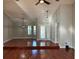 Spacious living room with vaulted ceilings, modern lighting, and hardwood floors at 202 Shady Oaks Cir, Lake Mary, FL 32746
