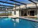 Inviting screened-in pool area with clear blue water and access to the home's interior at 202 Shady Oaks Cir, Lake Mary, FL 32746