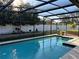 Relaxing screened-in pool surrounded by a meticulously landscaped backyard at 202 Shady Oaks Cir, Lake Mary, FL 32746