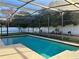 Refreshing screened-in pool with a patio deck, perfect for relaxation and outdoor entertainment at 202 Shady Oaks Cir, Lake Mary, FL 32746