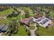 Aerial view of the golf course and clubhouse, showcasing the community amenities and landscape at 20604 Maxim Pkwy, Orlando, FL 32833
