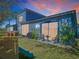 Outdoor patio area with seating, a grill, and a play area surrounded by lush green grass at 20604 Maxim Pkwy, Orlando, FL 32833