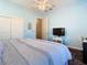 Comfortable bedroom featuring light blue walls, hardwood floors, and ample closet space at 20604 Maxim Pkwy, Orlando, FL 32833