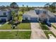 A home exterior with a spacious driveway and well-kept lawn, offering comfortable suburban living at 20604 Maxim Pkwy, Orlando, FL 32833