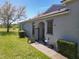 A charming exterior view showcasing a quaint entrance and well-maintained landscaping, adding to the home's curb appeal at 20604 Maxim Pkwy, Orlando, FL 32833