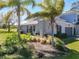 A well-maintained exterior with lush landscaping that enhances the curb appeal of the property in a sunny setting at 20604 Maxim Pkwy, Orlando, FL 32833