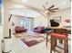 Bright living room with comfortable seating, bar, grand piano, and access to an outdoor space at 20604 Maxim Pkwy, Orlando, FL 32833