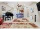 Open-concept living room with a piano, bar seating, and a view of the kitchen at 20604 Maxim Pkwy, Orlando, FL 32833