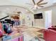 Inviting living room with comfortable seating, a grand piano, and an open layout at 20604 Maxim Pkwy, Orlando, FL 32833