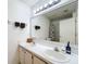 Bathroom featuring a double sink vanity, bright lighting, and tile flooring at 2112 White Eagle St, Clermont, FL 34714