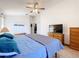 Spacious bedroom features carpet, a ceiling fan, and multiple chests of drawers at 2112 White Eagle St, Clermont, FL 34714