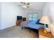 Bedroom features carpet, ceiling fan, window, and plenty of natural light at 2112 White Eagle St, Clermont, FL 34714