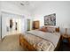 Bright bedroom features neutral carpet and an open closet with a wooden bookcase at 2112 White Eagle St, Clermont, FL 34714