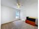 Spacious bedroom with neutral carpet, ceiling fan, a window and closet for ample storage at 2112 White Eagle St, Clermont, FL 34714