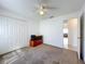 Neutral bedroom with a ceiling fan, closet, and easy access to the rest of the home at 2112 White Eagle St, Clermont, FL 34714