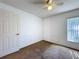 Bright bedroom with light walls, carpet, a window and a closet, creating a serene atmosphere at 2112 White Eagle St, Clermont, FL 34714